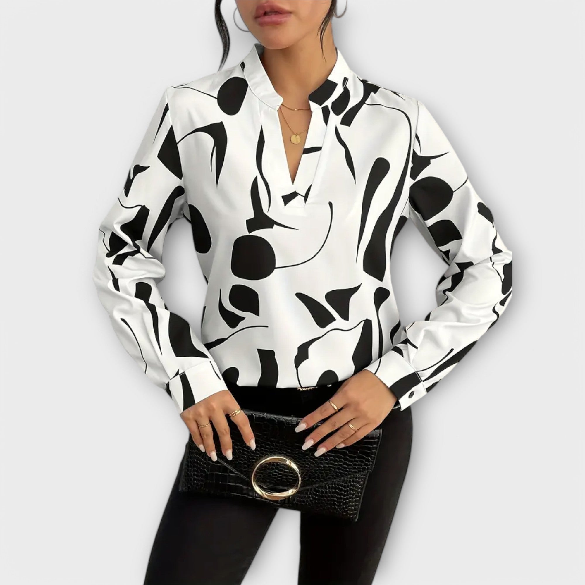 Elegant long-sleeved blouse with pointed neckline